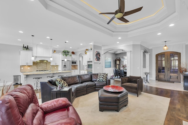 498 Double Bridge Rd, Boiling Springs, SC 29316 - living area with arched walkways, a ceiling fan, ornamental molding, recessed lighting, and decorative columns