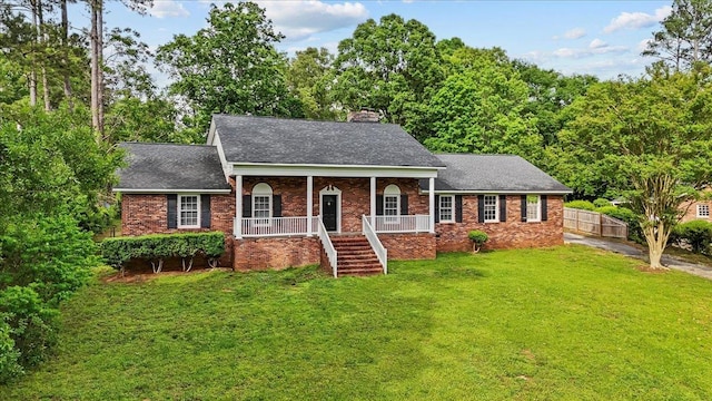 251 Winfield Dr, Spartanburg, SC 29307 - view of front of house featuring a chimney, a porch, brick siding, a shingled roof, and stairway