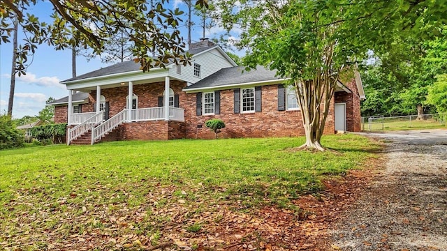 251 Winfield Dr, Spartanburg, SC 29307 - view of front facade featuring covered porch, driveway, brick siding, and a garage
