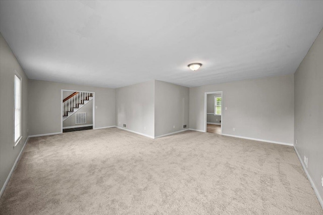 251 Winfield Dr, Spartanburg, SC 29307 - carpeted empty room with stairway and baseboards