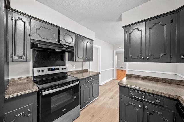 251 Winfield Dr, Spartanburg, SC 29307 - kitchen with black / electric stove, under cabinet range hood, light wood-type flooring, a textured ceiling, and dark countertops