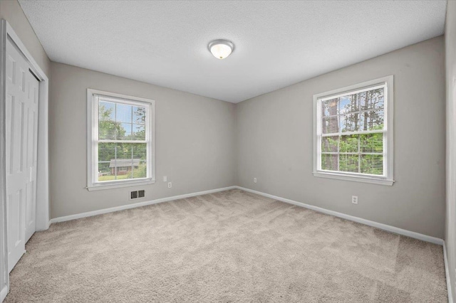 251 Winfield Dr, Spartanburg, SC 29307 - unfurnished bedroom with carpet floors, a closet, and a textured ceiling