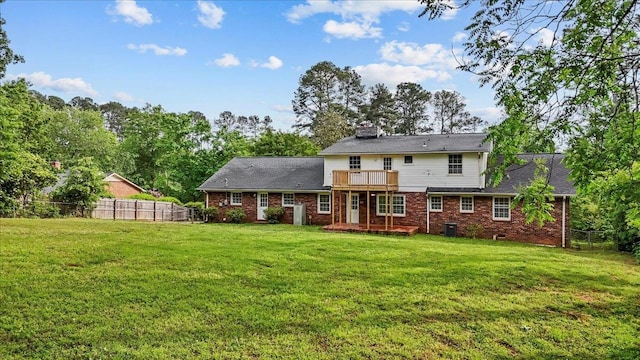 251 Winfield Dr, Spartanburg, SC 29307 - rear view of house with brick siding, a chimney, a balcony, a wooden deck, and view of scattered trees