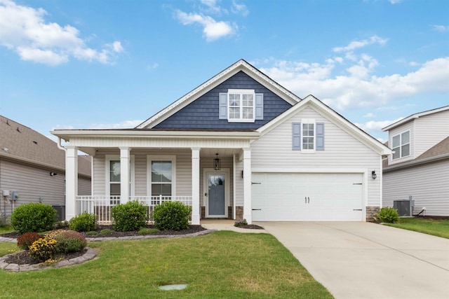 881 Deepwood Ct, Boiling Springs, SC 29316 - view of front of house featuring covered porch, driveway, a garage, a front yard, and stone siding