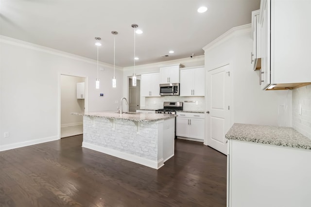 881 Deepwood Ct, Boiling Springs, SC 29316 - kitchen with stainless steel appliances, tasteful backsplash, white cabinetry, light stone countertops, and dark wood-type flooring