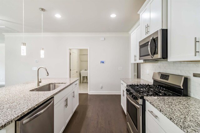 881 Deepwood Ct, Boiling Springs, SC 29316 - kitchen featuring stainless steel appliances, ornamental molding, backsplash, dark wood-style flooring, and light stone countertops