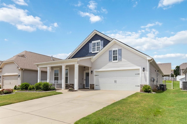 881 Deepwood Ct, Boiling Springs, SC 29316 - view of front facade with covered porch, stone siding, a front yard, and driveway