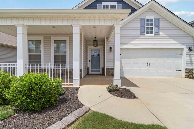 881 Deepwood Ct, Boiling Springs, SC 29316 - view of front facade with stone siding, driveway, and covered porch