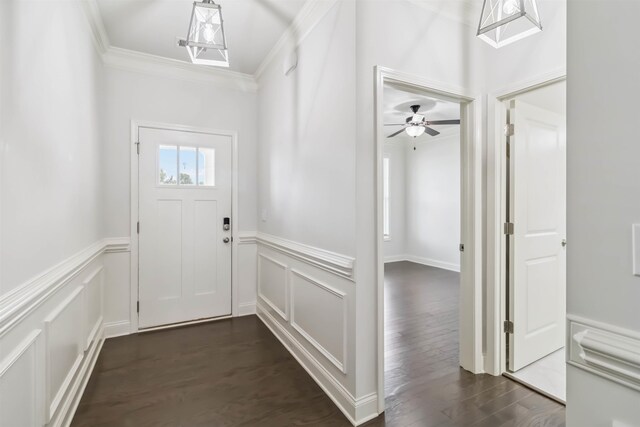 881 Deepwood Ct, Boiling Springs, SC 29316 - doorway with ornamental molding, a wainscoted wall, dark wood-style flooring, a decorative wall, and a ceiling fan