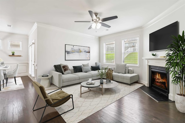 881 Deepwood Ct, Boiling Springs, SC 29316 - living area with ornamental molding, a warm lit fireplace, plenty of natural light, and hardwood / wood-style floors