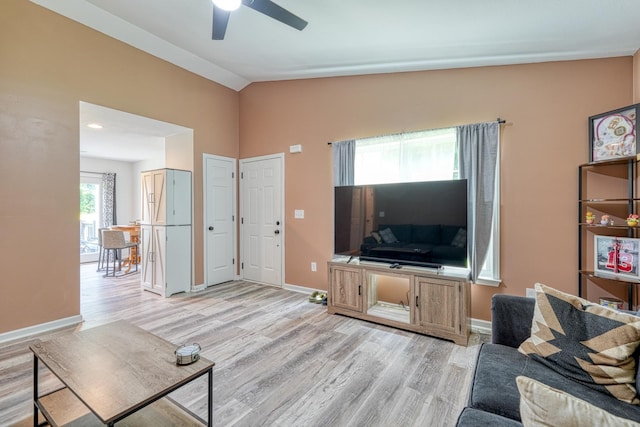 703 Patriot Ln, Greer, SC 29651 - living area with vaulted ceiling, light wood-style flooring, and a ceiling fan