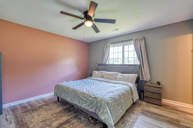 703 Patriot Ln, Greer, SC 29651 - bedroom with wood finished floors and a ceiling fan