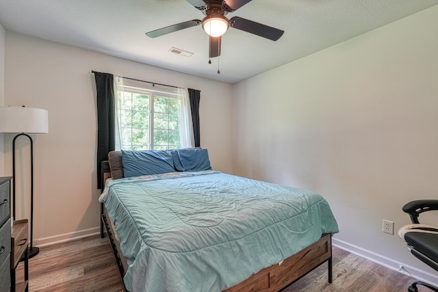 703 Patriot Ln, Greer, SC 29651 - bedroom with wood finished floors and a ceiling fan