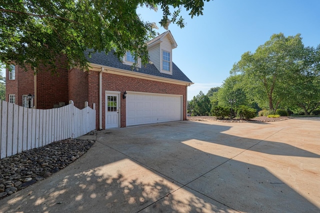 95 Roscommon Run, Moore, SC 29369 - view of side of property featuring concrete driveway, brick siding, a garage, and a shingled roof