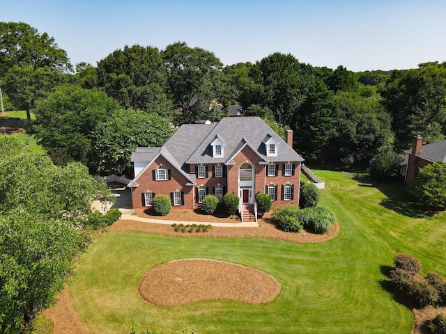 95 Roscommon Run, Moore, SC 29369 - view of front of house with brick siding, a front lawn, and a chimney