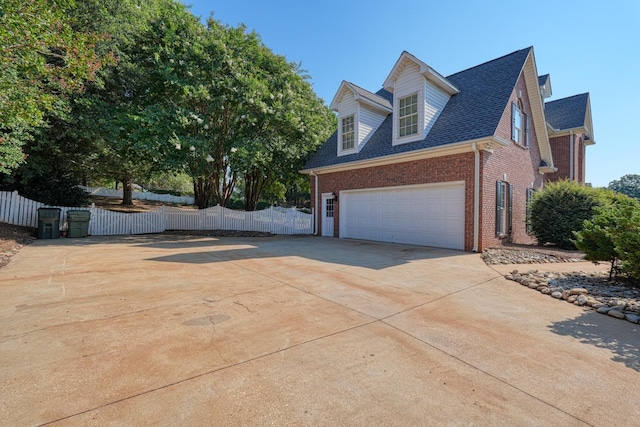 95 Roscommon Run, Moore, SC 29369 - view of home's exterior with brick siding, driveway, and roof with shingles