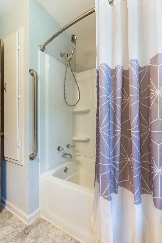 210 Catawba St, Union, SC 29379 - bathroom featuring shower / bath combination with curtain and baseboards