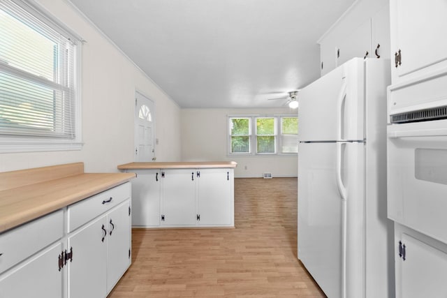 114 W Carolina St, Duncan, SC 29344 - kitchen with white appliances, ceiling fan, white cabinets, light wood-style floors, and light countertops