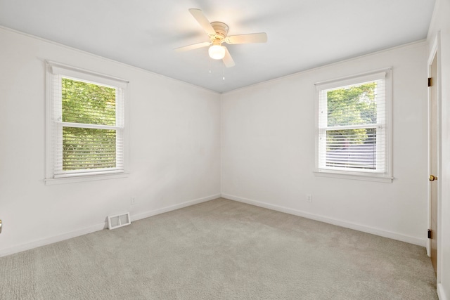 114 W Carolina St, Duncan, SC 29344 - empty room with plenty of natural light, carpet floors, and ceiling fan