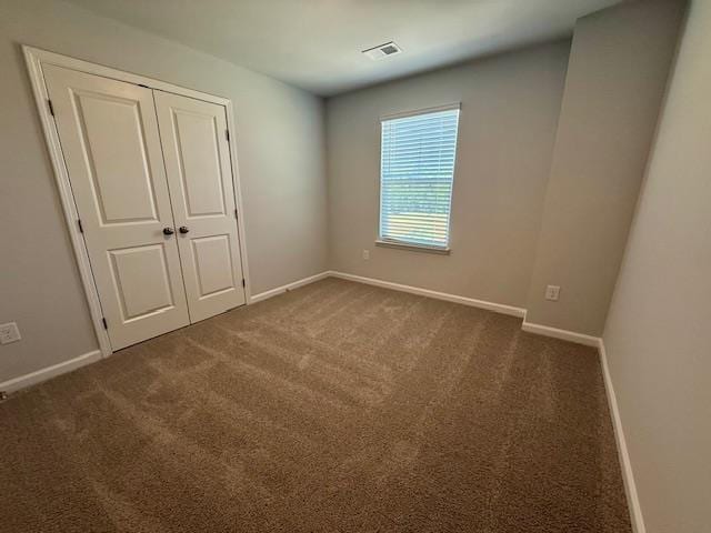 1236 Forestbrook Ln, Spartanburg, SC 29303 - unfurnished bedroom featuring carpet flooring and a closet