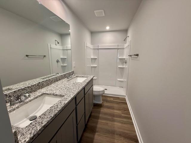 1236 Forestbrook Ln, Spartanburg, SC 29303 - full bathroom featuring a shower stall, wood finished floors, and double vanity
