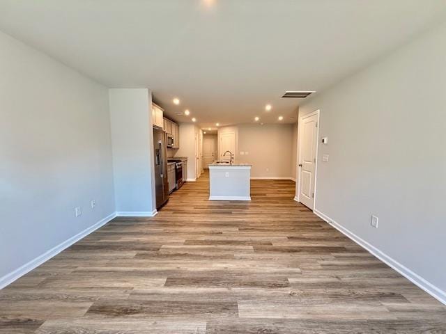 1236 Forestbrook Ln, Spartanburg, SC 29303 - unfurnished living room with recessed lighting and wood finished floors