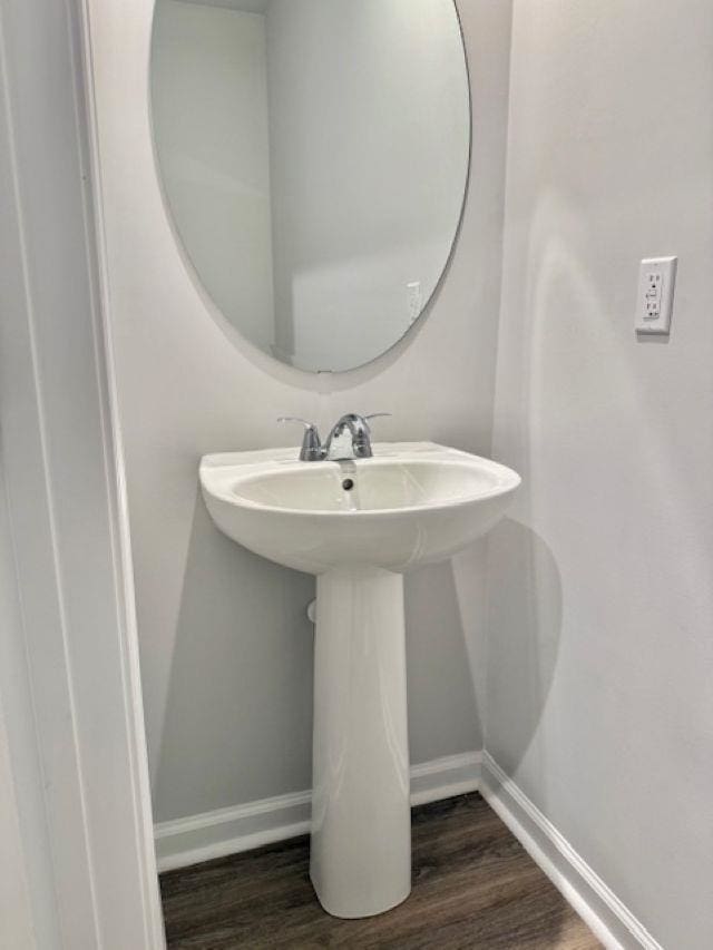 1236 Forestbrook Ln, Spartanburg, SC 29303 - bathroom featuring baseboards and wood finished floors
