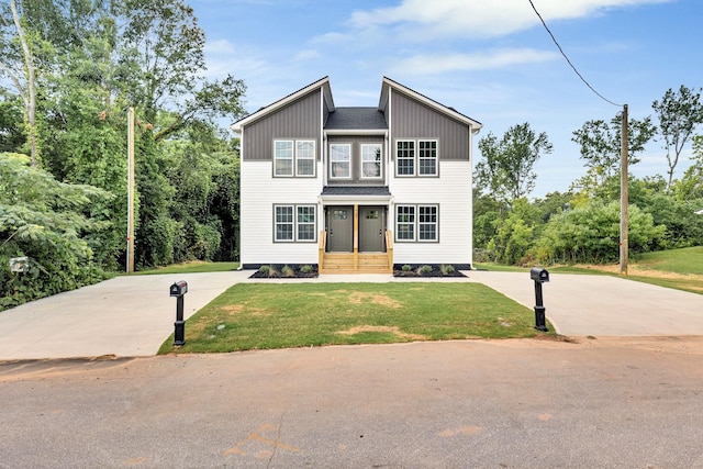 938 Logan St, Spartanburg, SC 29306 - view of front of property featuring a front lawn and concrete driveway