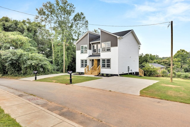 938 Logan St, Spartanburg, SC 29306 - view of front of property with a front lawn and board and batten siding