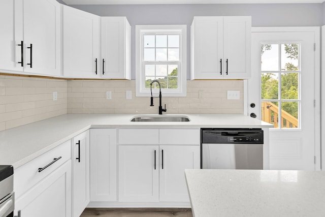 938 Logan St, Spartanburg, SC 29306 - kitchen with dishwasher, plenty of natural light, light countertops, and white cabinets