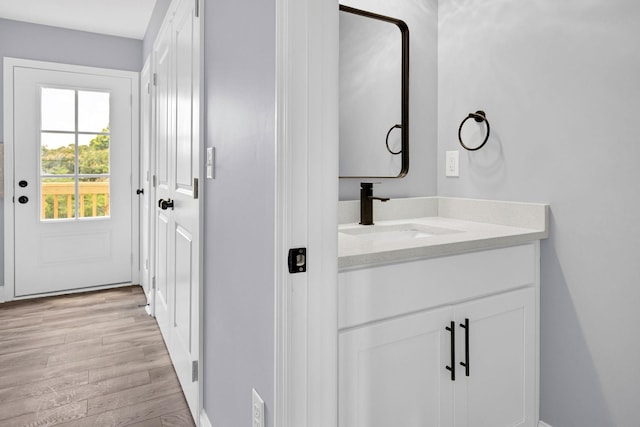 938 Logan St, Spartanburg, SC 29306 - bathroom with wood finished floors and vanity