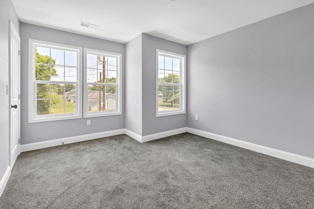 938 Logan St, Spartanburg, SC 29306 - carpeted spare room with baseboards
