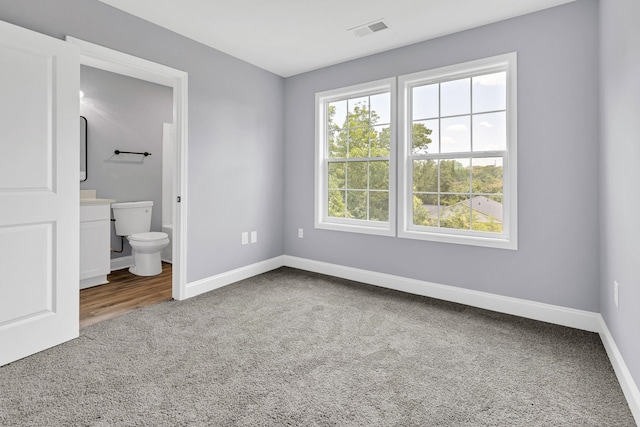 938 Logan St, Spartanburg, SC 29306 - unfurnished bedroom featuring carpet flooring and ensuite bath