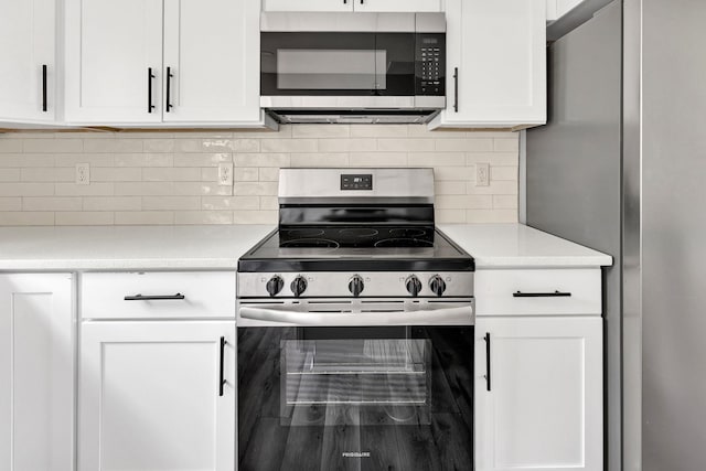 938 Logan St, Spartanburg, SC 29306 - kitchen with stainless steel appliances, white cabinetry, and light countertops