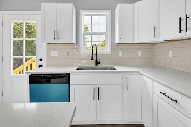 938 Logan St, Spartanburg, SC 29306 - kitchen featuring dishwasher, white cabinetry, tasteful backsplash, and healthy amount of natural light