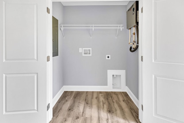938 Logan St, Spartanburg, SC 29306 - laundry room with electric dryer hookup, washer hookup, wood finished floors, and electric panel