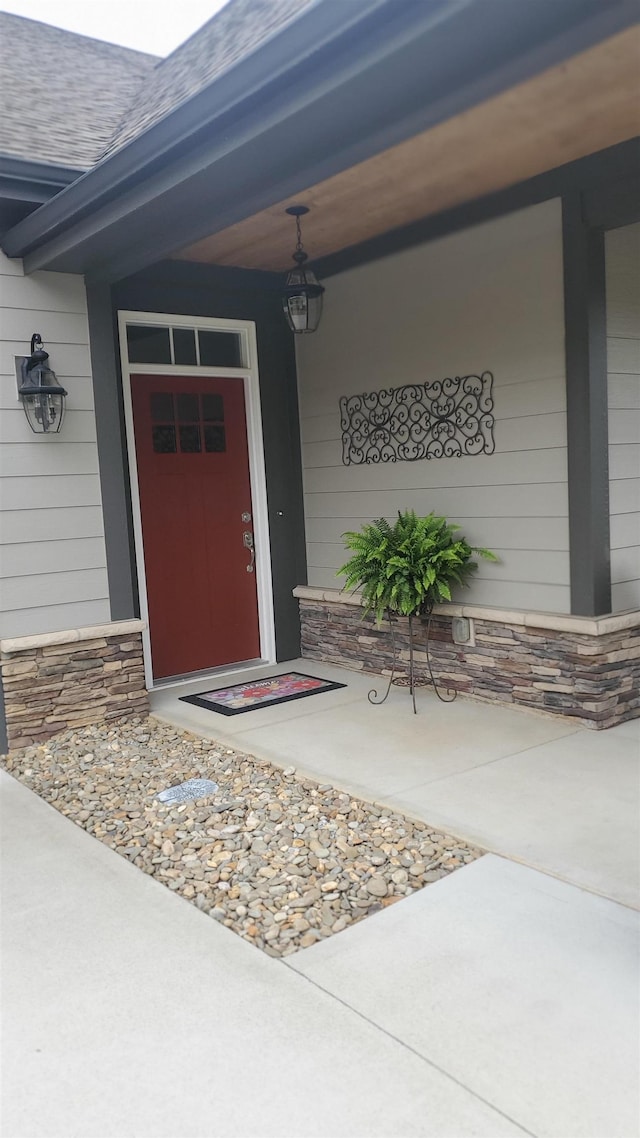 178 Ravines Ln, Spartanburg, SC 29301 - view of exterior entry featuring a porch, stone siding, and roof with shingles