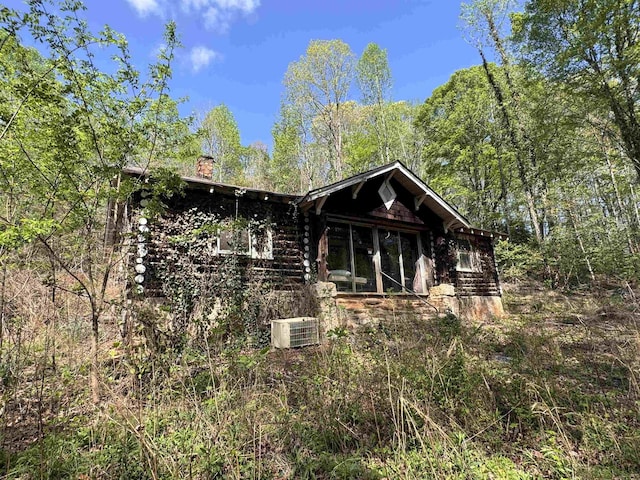 8875 N Tigerville Rd, Travelers Rest, SC 29690 - view of front of home featuring a chimney and log siding