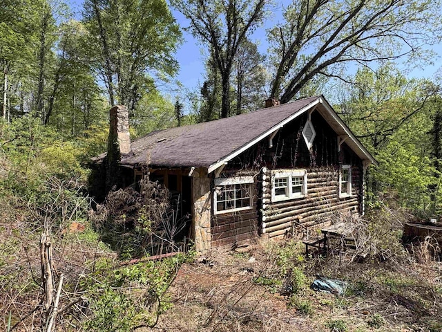 8875 N Tigerville Rd, Travelers Rest, SC 29690 - view of side of home featuring a chimney and log siding