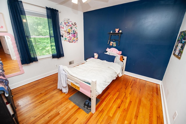 72 Casey Ln, Spartanburg, SC 29301 - bedroom featuring wood finished floors, multiple windows, and ceiling fan