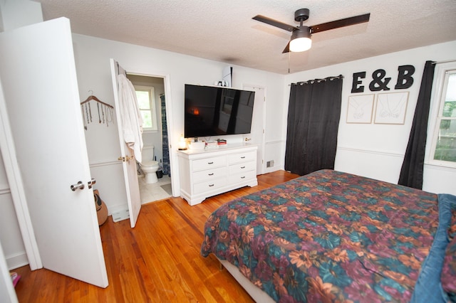 72 Casey Ln, Spartanburg, SC 29301 - bedroom with light wood finished floors, a textured ceiling, ensuite bath, and ceiling fan