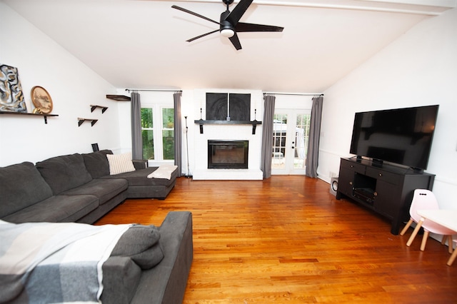 72 Casey Ln, Spartanburg, SC 29301 - living room with vaulted ceiling, ceiling fan, light wood finished floors, healthy amount of natural light, and a large fireplace