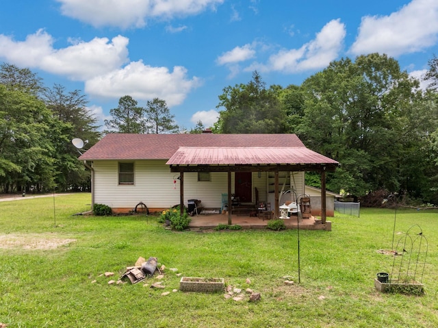 1342 Old Canaan Rd, Spartanburg, SC 29306 - rear view of property with a lawn, a patio area, and a metal roof