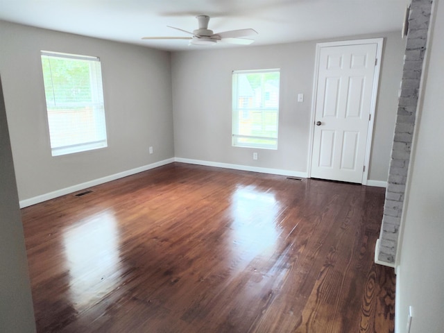 117 Sycamore St, Pacolet, SC 29372 - empty room featuring ceiling fan, plenty of natural light, and dark wood-style flooring