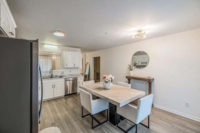 521 Signal Hill Ln, Inman, SC 29349 - dining area featuring light wood-type flooring and baseboards