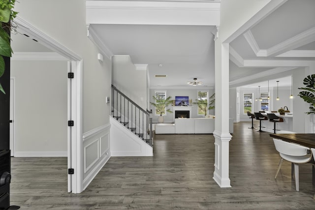 3027 Toliver, Boiling Springs, SC 29316 - foyer entrance with a warm lit fireplace, stairs, wood finished floors, and ornamental molding