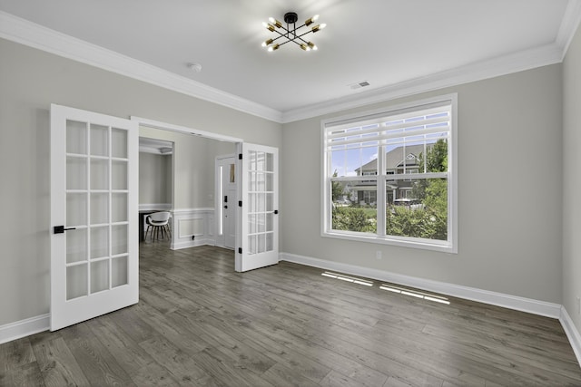 3027 Toliver, Boiling Springs, SC 29316 - spare room featuring french doors, a chandelier, ornamental molding, wood finished floors, and a smoke detector