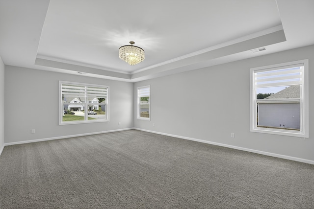 3027 Toliver, Boiling Springs, SC 29316 - carpeted empty room featuring a tray ceiling, a chandelier, and ornamental molding