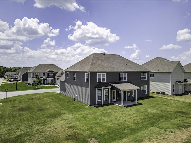 3027 Toliver, Boiling Springs, SC 29316 - back of property featuring a residential view, a patio area, a lawn, a shingled roof, and driveway