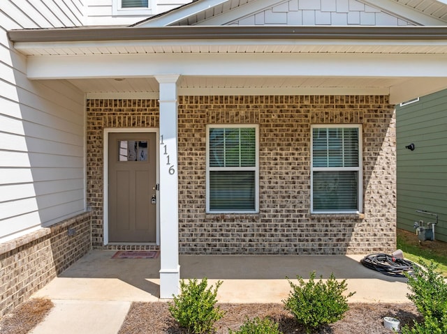 1116 Denington Dr, Spartanburg, SC 29307 - view of exterior entry with brick siding and covered porch